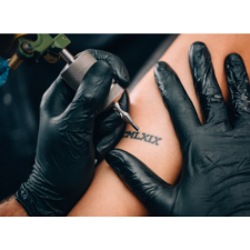 tattoo artist at work as a picture for the tattoo supplies collection